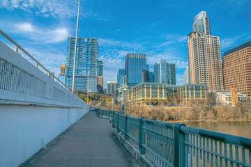 Austin, Texas- Bridge sidewalk over the Colorado River with a view of high-rise buildings