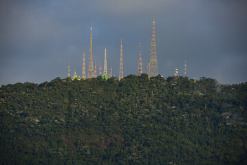 The radio masts and telecommunications towers at the top of Sumaré hill and above the dense,...