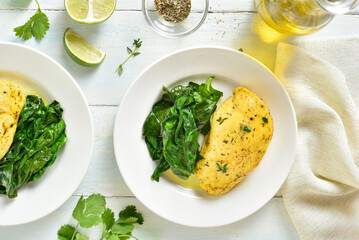 Baked turmeric chicken breast and sauteed spinach