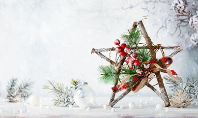 Christmas still life with decorated wooden Christmas Star on light background. Winter festive...