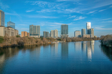 Fototapeta na wymiar Colorado River with a reflection of the skyscrapers at Austin, Texas