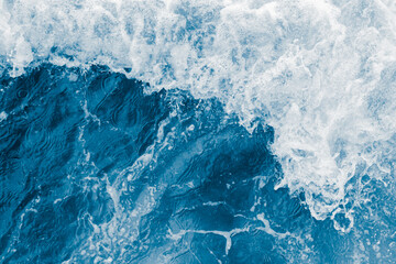 Fototapeta na wymiar Dark blue sea ocean wave and white foam