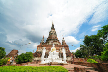 Ruins of pagodas, monks and walls that remain of Wat Yai Chaimongkol, Ayutthaya, Thailand, were...