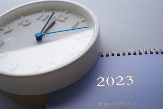count down to year 2023- 12 o'clock wall clock and 2023 desk calendar