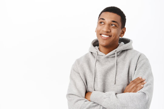 Happy People. Smiling African American Man With Hopeful Smile, Looking At Camera Confident, Standing Over White Background