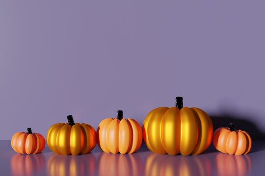 3d render of orange and gold pumpkins front view on a purple background