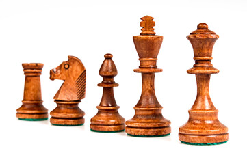 set of black chess pieces in a row