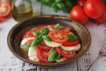 A bowl with traditional Italian caprese salad