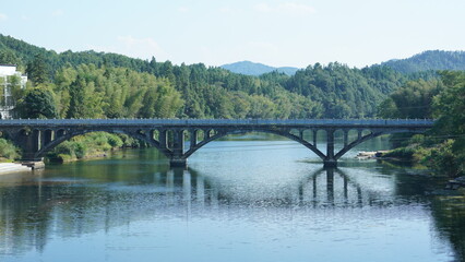 Fototapeta na wymiar The old arched stone bridge view located in the countryside of the China