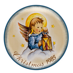 Vintage Sister Berta Hummel Christmas Plate from 1985 entitled Heavenly Light, isolated on white.