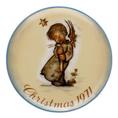 Vintage Sister Berta Hummel Christmas Plate from 1971 entitled Angel with Candle, isolated on white.