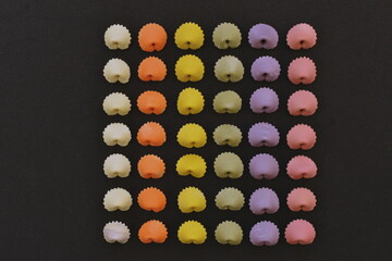 Close-up neatly arranged colorful pasta
