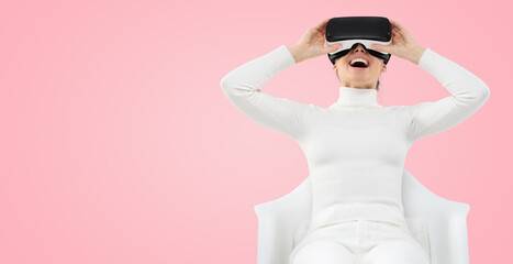 Horizontal banner of female feeling excited with her virtual reality experience, holding VR headset