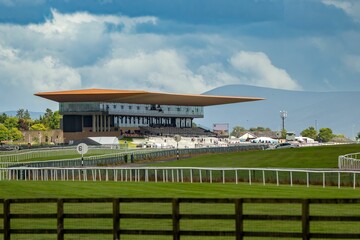 View of one of the most important Curragh racecourse under blue sky with clouds, Newbridge, Ireland