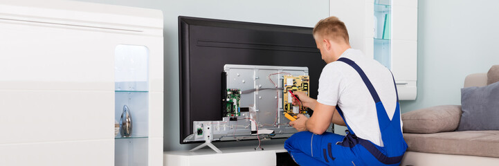 Electrician Checking Television