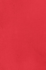 Saturated crimson red colored low contrast Concrete textured background. Empty colorful wall texture with copy space for text overlay and mockups. 2023, 2024 color trend