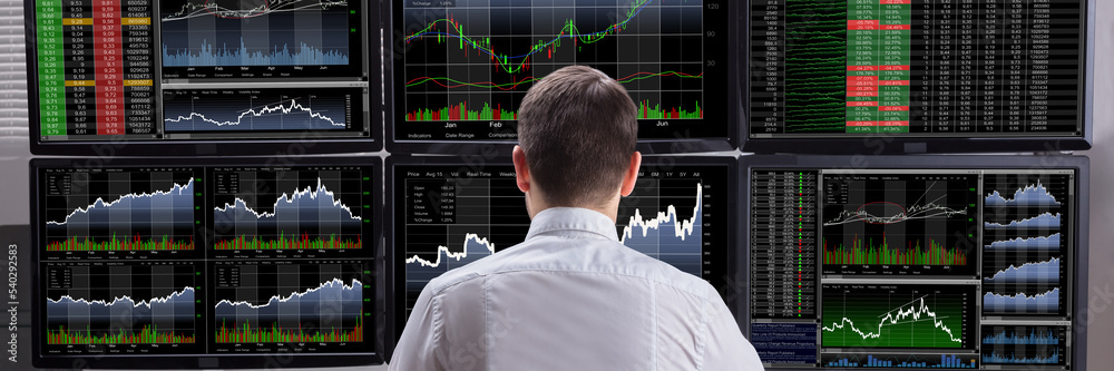 Poster stock market broker analyzing graphs on computer screens