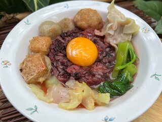 Brown rices, meat ball and yulk with red sauce