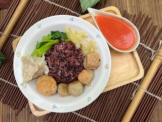 Brown rices, meat ball and yulk with red sauce