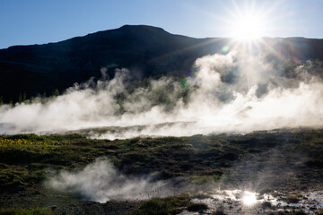 Strokkur Geyser with evening against light,Iceland