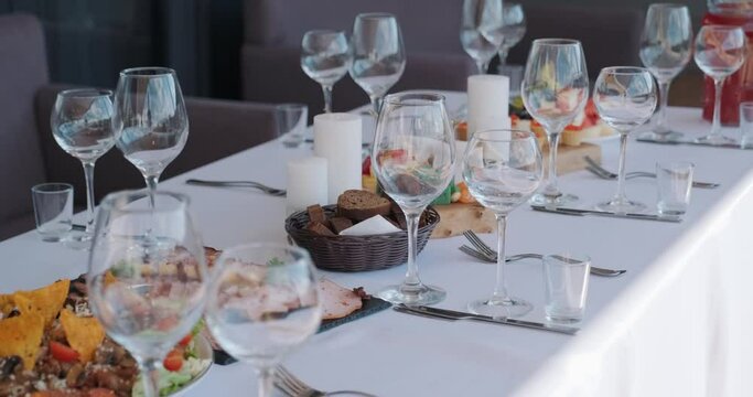 Served dinner table in a restaurant, cafe. Banquet, official celebrating.