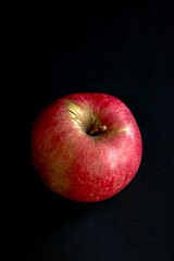 Red apple on a dark background