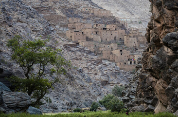 ancient village, castle on hills, in the Moroccan mountains, beautiful nature, large valleys, historical ruins, sublime architecture built by natural means, stone and sand.