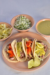 Arrachera tacos, mexican food with a white background vertical