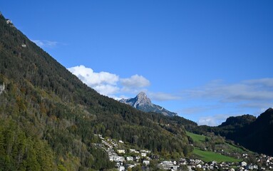 Fototapeta na wymiar landscape in the mountains, alpine town bludenz in austria, blue sky with clouds