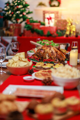 Chirstmas dinner including turkey place on family table ready to be eaten.