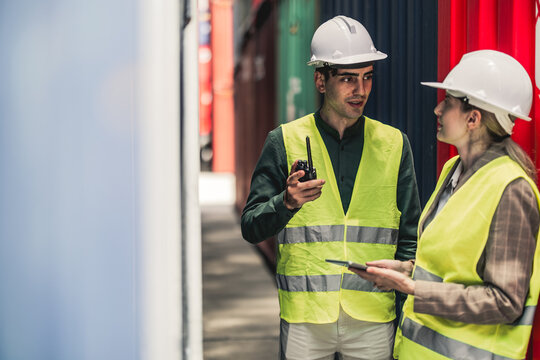Container worker discussing their daily task together before they start their daily task.