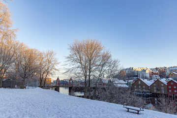 Walking along the Nidelven (river) on a cold winter's day in Trondheim city, Trøndelag, Norway