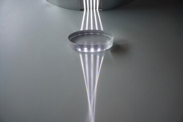 Parallel light passes through a convex lens and is refracted into the focus. Optics physics.