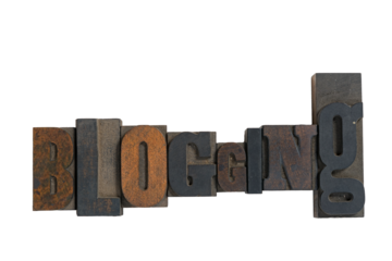 Isolated antique wood block type in reverse spelling blogging