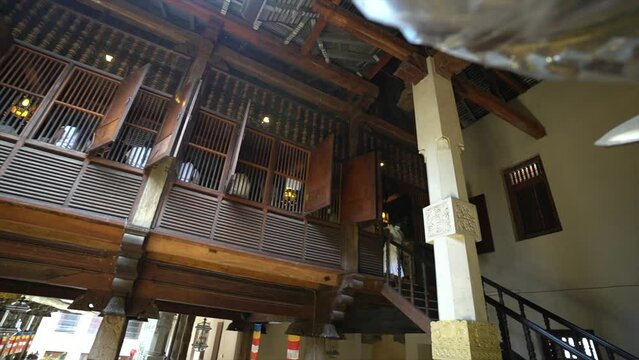 Fassade of buddhist temple in Kandy sri lanka with old windows and wooden design