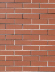 Fondo con detalle y textura de superficie de ladrillo ceramico de tonos anaranjados y rojizos