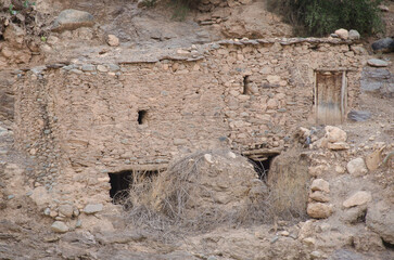 ancient village, castle on hills, in the Moroccan mountains, beautiful nature, large valleys, historical ruins, sublime architecture built by natural means, stone and sand.