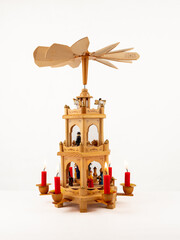 Christmas pyramid. Christmas carols, singers in the form of wooden figures.