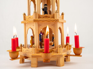 Christmas pyramid. Christmas carols, singers in the form of wooden figures.