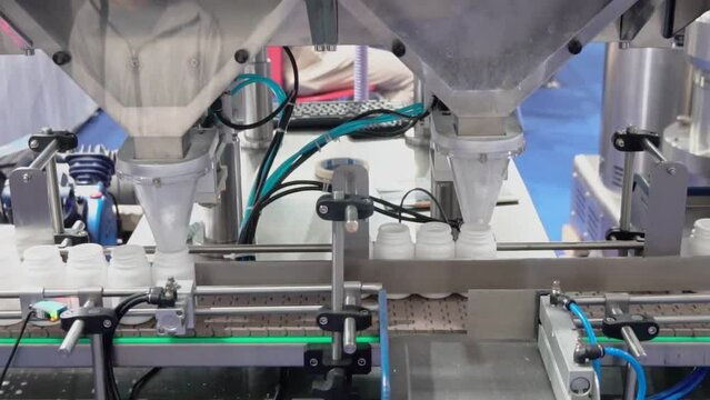 Pharmaceutical industry, transfer medicine bottles on the conveyor belt in the pharmaceutical industry, machine conveyor line at the medical factory production line.