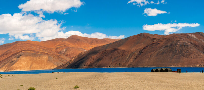 Indian Army tents near Pangong Lake world’s highest saltwater lake dyed in blue stand in stark contrast to the arid mountains surrounding i