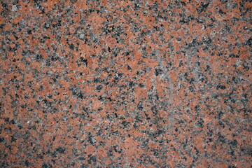 Fondo con detalle y textura de superficie de marmol  en tonos rojizos, grises y negros