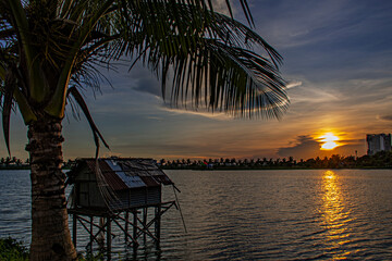 sunset on the lake with the fishing deck at golden hour