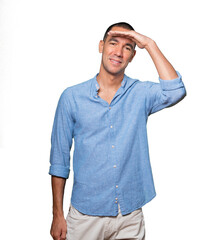Fototapeta premium Happy young man with a gesture of looking away