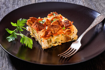 Scalloped Chicken Casserole topped with croutons