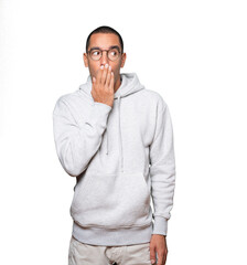 Fototapeta premium Astonished young man with a gesture of shock