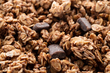 Side close view of a serving of chocolate chunk granola.