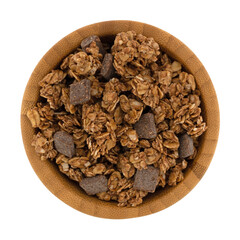 Top view of a wood bowl filled with chocolate chunk granola isolated on a white background.