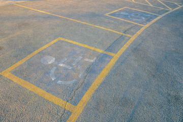 Fototapeta premium Camelback Mountain, Phoenix, Arizona- Parking lot sign for disabled on a concrete pavement