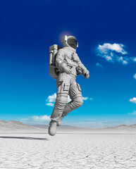 astronaut is walking in the desert of another planet after rain bottom view